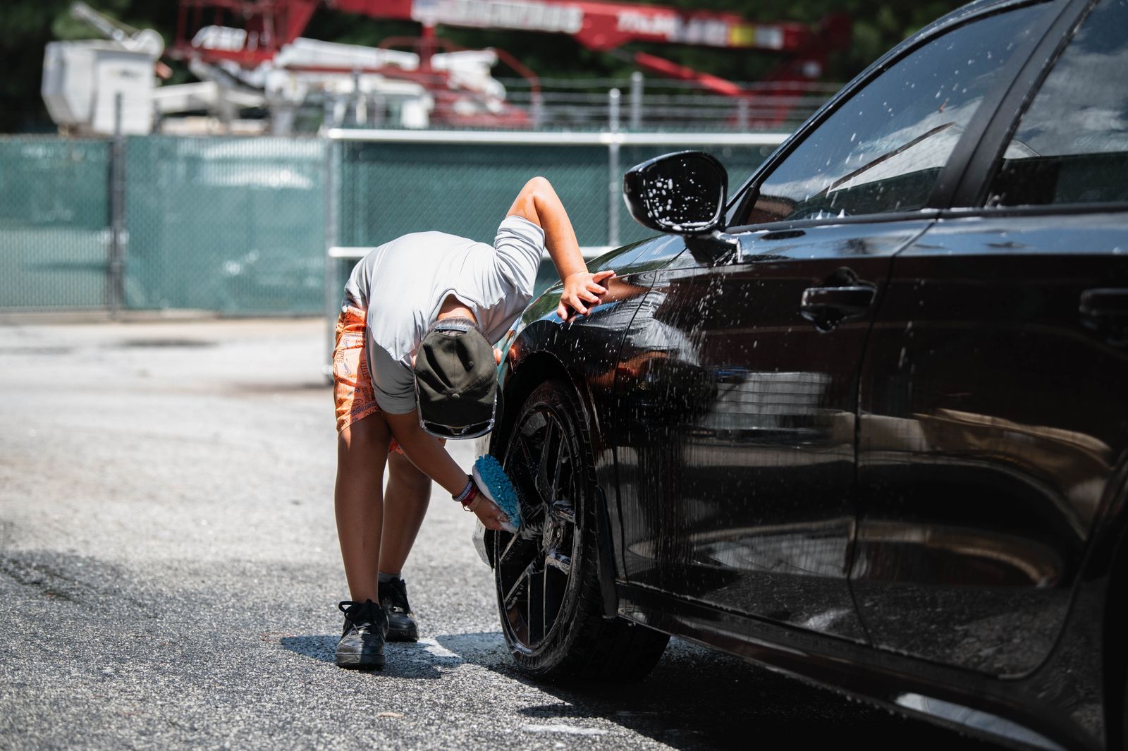 Mobile detailer working on a car